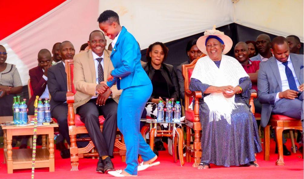 Ruto's Mother Covers Reporter with 'Shuka' Over Dress Length