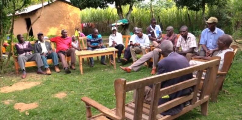 Relatives of slain witch doctor Ayub Lusweti gather at his home in Matete village, Lugari Constituency, to plan his funeral.