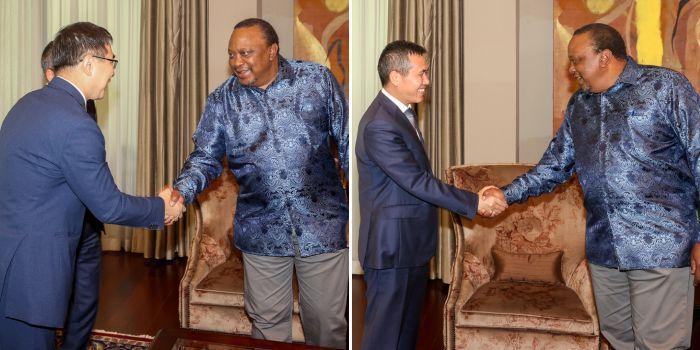 Former President Uhuru Kenyatta greets Chinese Ambassador Zhou Pingjian.
