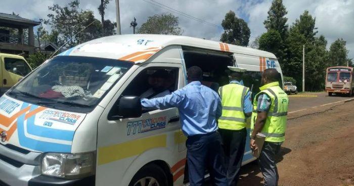 A photo of NTSA officials inspecting a vehicle on November 11, 2022.