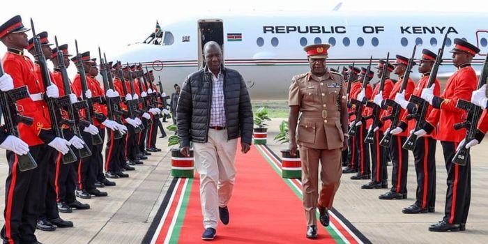 President William Ruto inspects a guard of honour at Jomo Kenyatta International Airport after jetting back from Europe on Thursday, March 30, 2023.