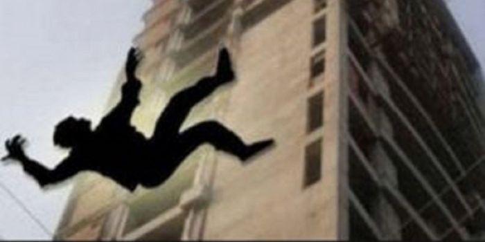 A photo of an illustration of a man falling from a building.