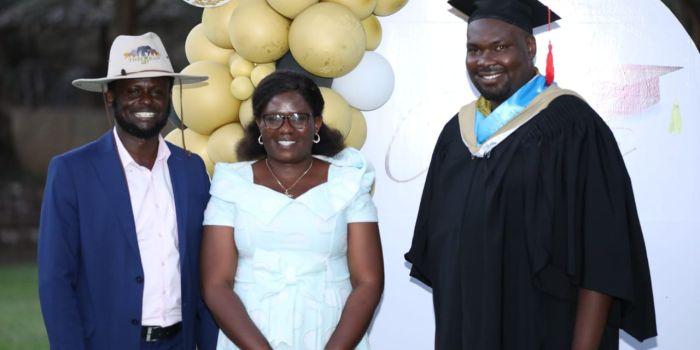 Timothy Mwangaza together with the mother and Murega Baichu at his graduation in July 2023.