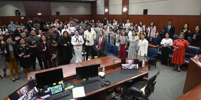 Kenyans and other individuals take an oath of American citizenship on January 16, 2024.