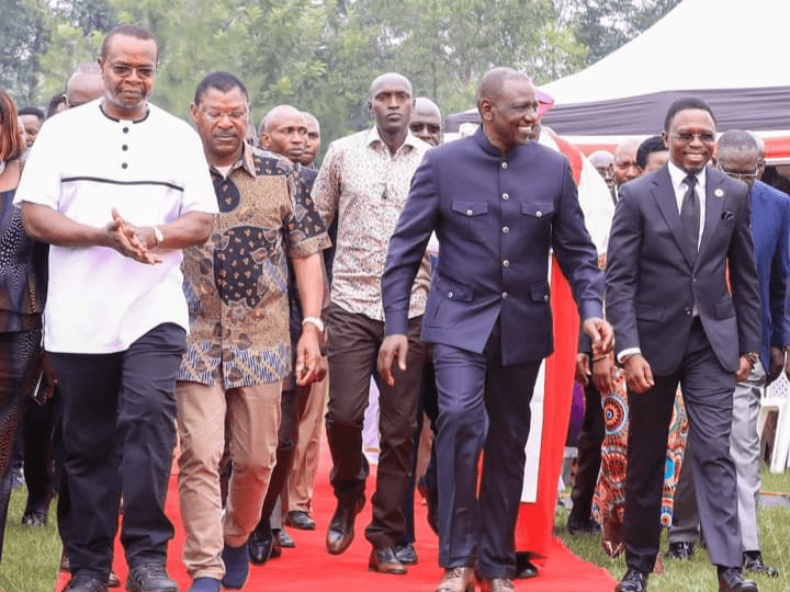 President William Ruto, Busia Governor Paul Otuoma, CS Ababu Namwamba and Speaker Moses Wetang'ula walking to Machakus Primary School for Church Service/