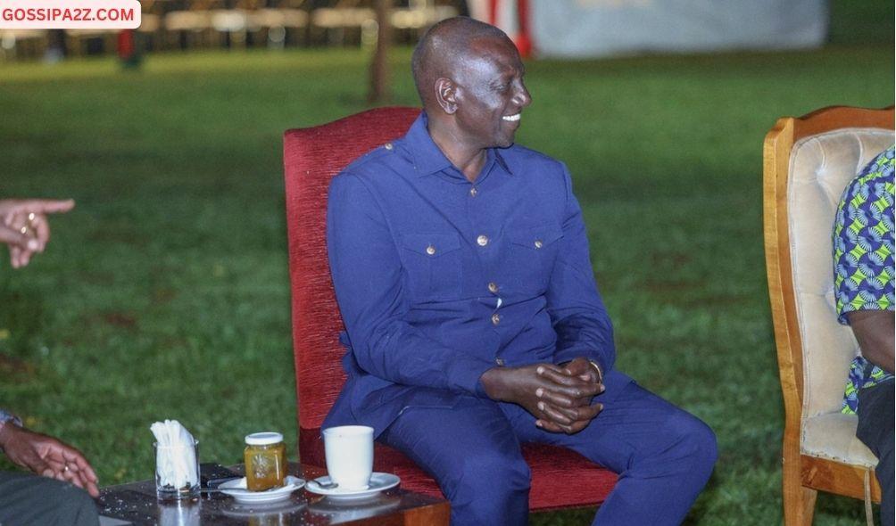 President Ruto enjoying a cup of tea with a tin of honey at his side.