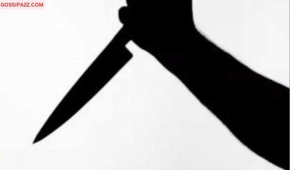 a silhouette of a person holding a knife