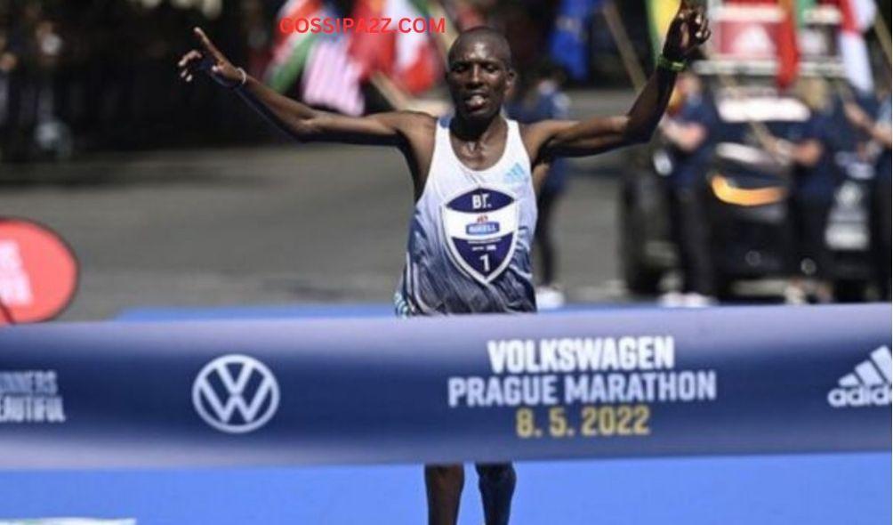 An image of Nobert Kigen, crossing the finish line as he won the Prague international marathon in 2022