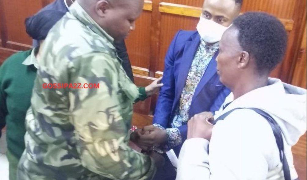 Prison officers uncuff Jowie as his mother looks on.