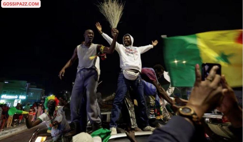 Supporters of Senegalese presidential candidate Bassirou Diomaye Faye celebrate early results showing that Faye is leading initial presidential election tallies, in Dakar, Senegal, March 24, 2024. REUTERS