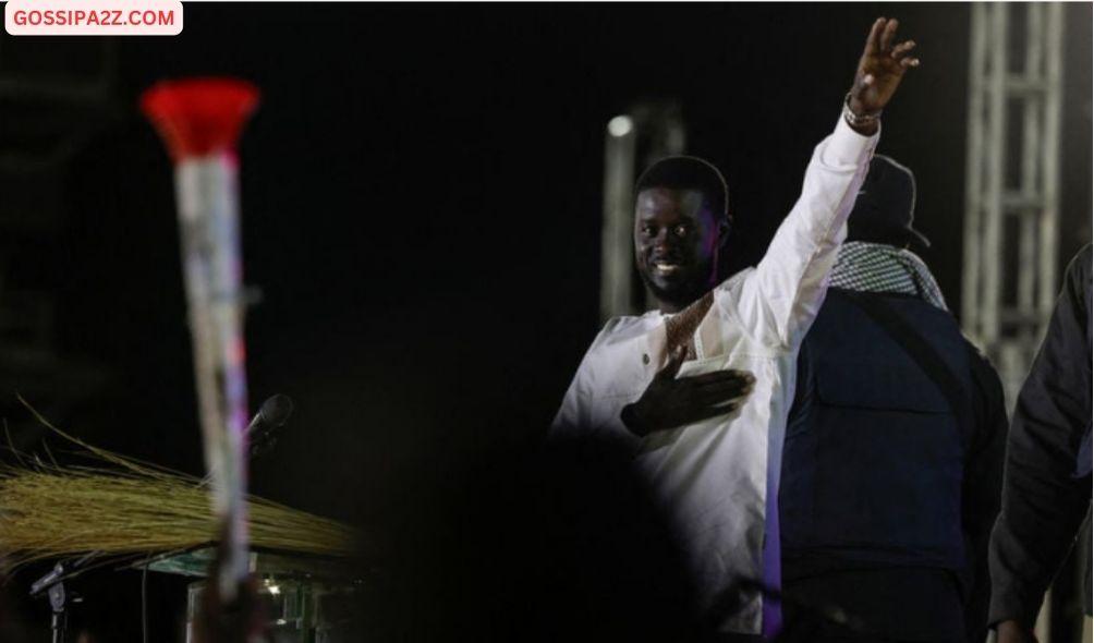 Senegalese presidential candidate Bassirou Diomaye Faye cheers supporters up during his final campaign rally in Mbour, Senegal March 22, 2024.