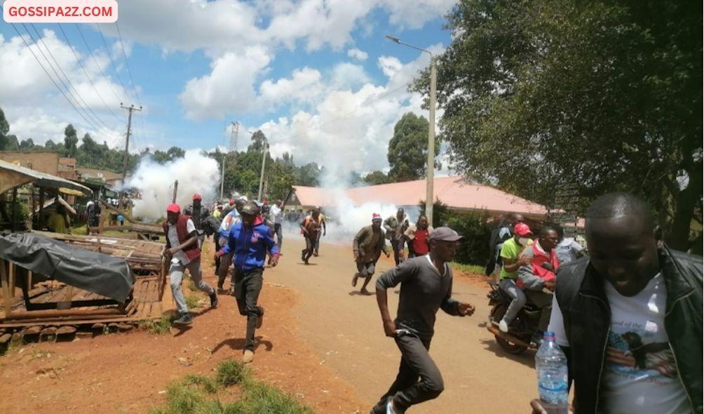 Police disperse residents of who were protesting delayed repairs to a dilapidated briedge in the area.