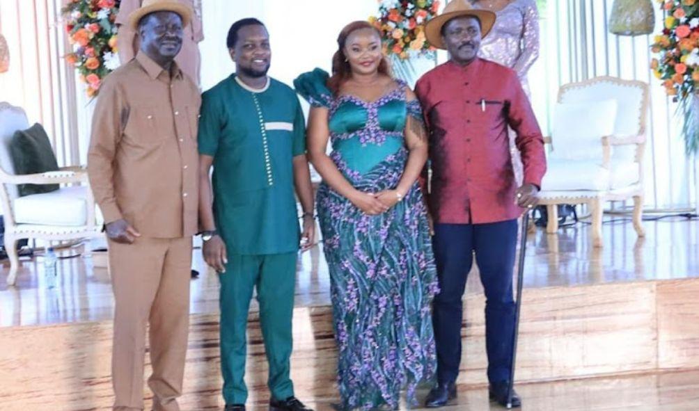 Opposition leader Raila Odinga pose for a photo with the groom (Kelvin Muasya), bride (Sharon Nthoki) and Kalonzo Musyoka during wedding ceremony on May 11, 2024.