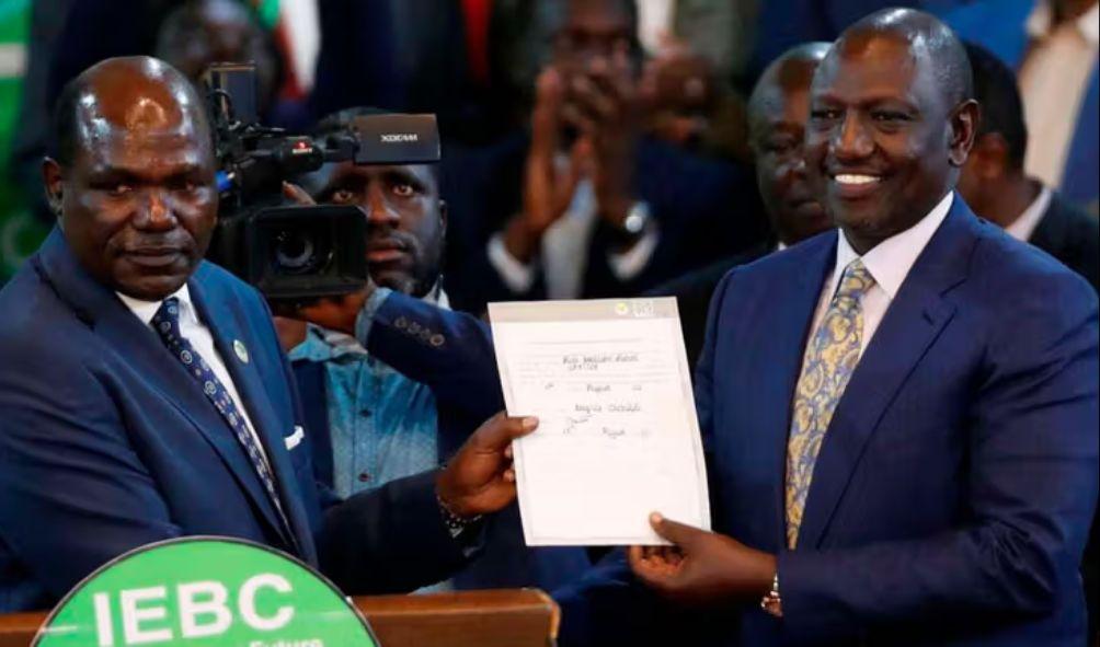 President-elect William Ruto with then IEBC chairman Wafula Chebukati after he was declared the winner of Kenya's presidential election at the IEBC National Tallying Centre at the Bomas of Kenya, in Nairobi, Kenya August 15, 2022