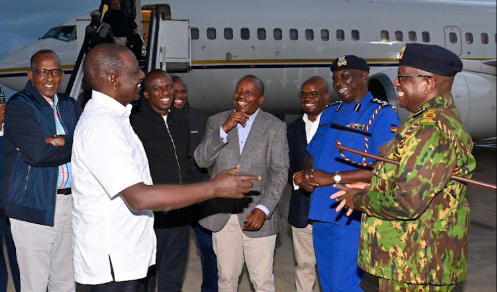 President William Ruto interacts with leaders at the airport on May 25, 2024.