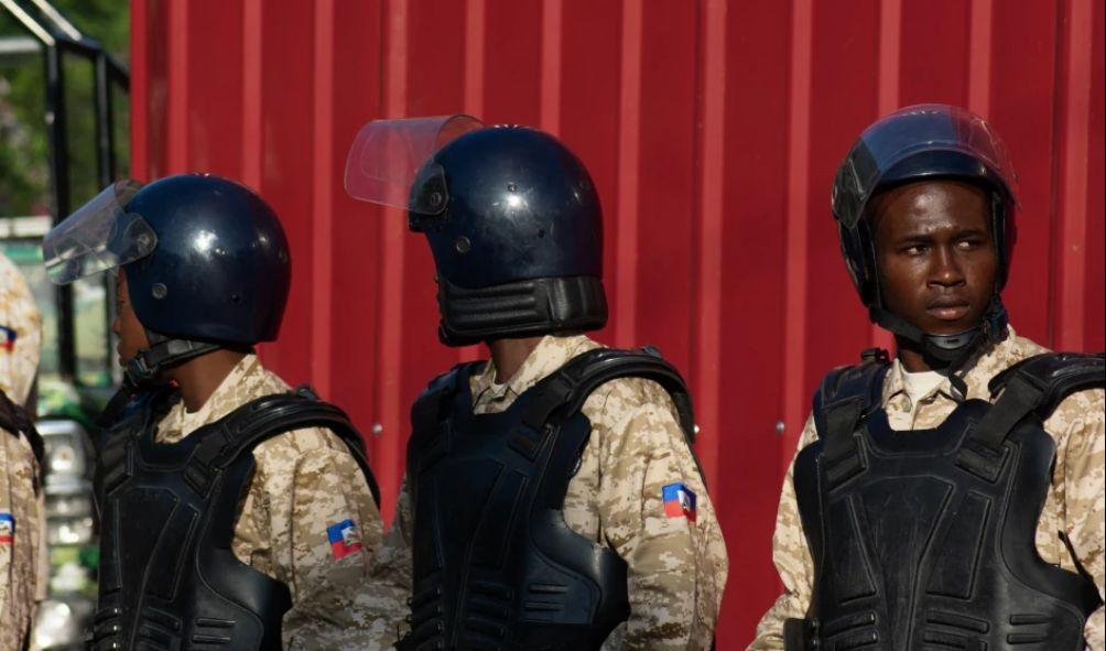 Members of the Haitian military stand watch outside of a ceremony attended by members of Haiti's Transitional Presidential Council to mark Haitian Flag Day in Port-au-Prince, Haiti on May 18, 2024. Haiti's transitional ruling council, which is leading the violence-wracked Caribbean nation, will rotate its leadership every five months according to a decree seen by AFP on May 11, 2024, following internal political strife among its members (Photo by Clarens SIFFROY / AFP)