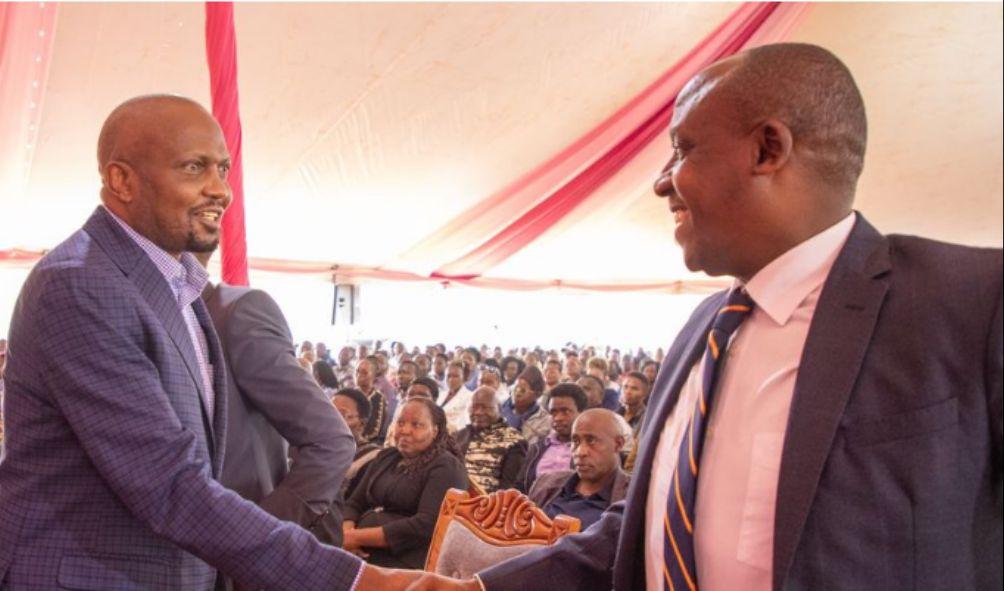 Former CS Moses Kuria greets Makueni Governor Mutula Kilonzo Junior at Kalimbini region in Makueni County on July 26, 2024. Mr Kuria scoffed at the recent cabinet changes.