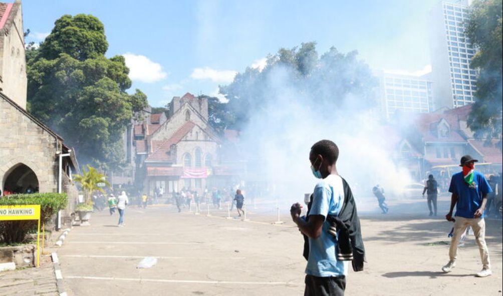 Protestors and medics scampering for shelter after police threw teargas at the All Saints Cathedral in June 2024