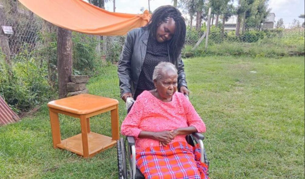 Esther Nyaruri (in the wheelchair) with her daughter Beatrice Bochere at their home in Ngata Estate, Nakuru.