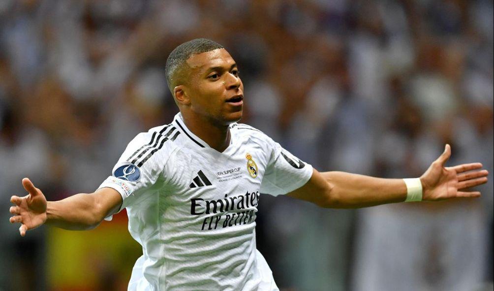 Real Madrid's French forward Kylian Mbappe celebrates scoring during the UEFA Super Cup football match between Real Madrid and Atalanta BC in Warsaw, on August 14, 2024. (Photo by Wojtek RADWANSKI / AFP)