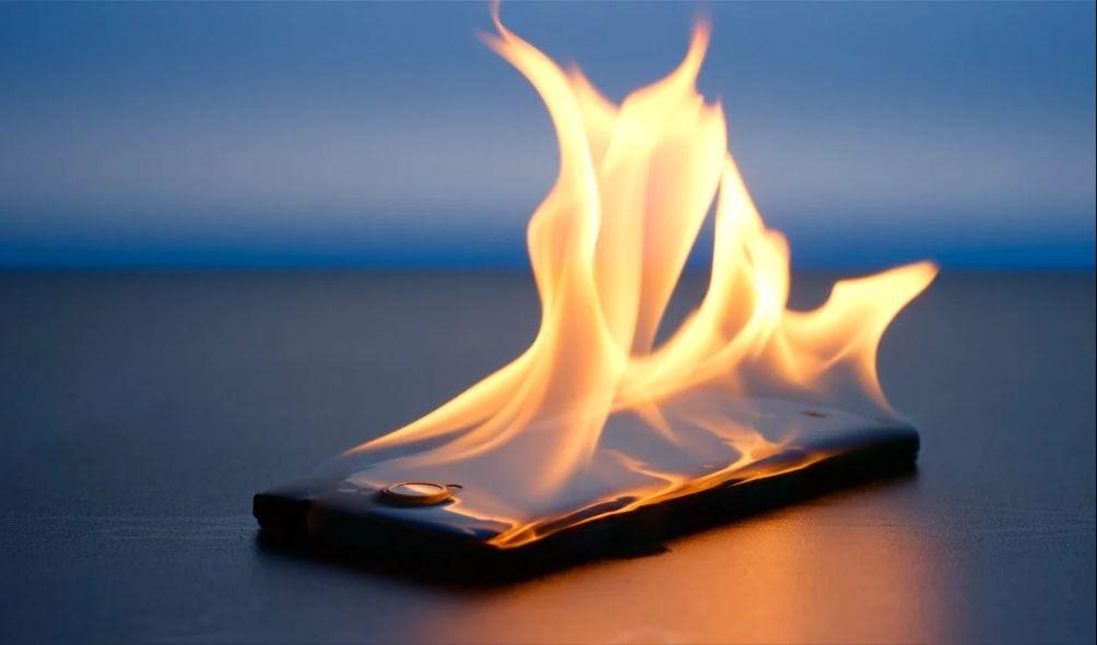 File image of a mobile phone in flames