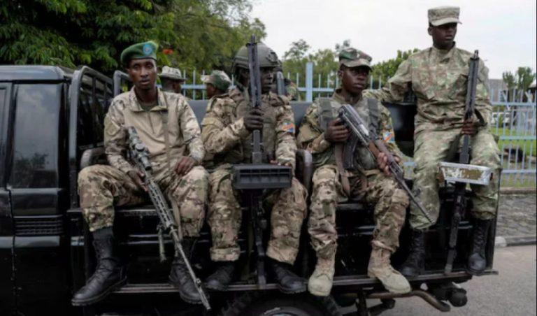 M23 rebels sit on a truck during the escort of captured FDLR members (not pictured) to Rwanda for repatriation, at the Goma-Gisenyi Grande Barrier border crossing, March 1, 2025. REUTERS/Arlette Bashizi//File Photo