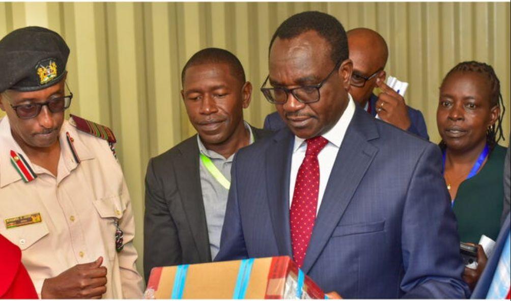 Education Cabinet Secretary Julius Ogamba supervises the distribution of Day 1 KCSE exam papers at the Kibra DCC container. PHOTO/ MOE Kenya.