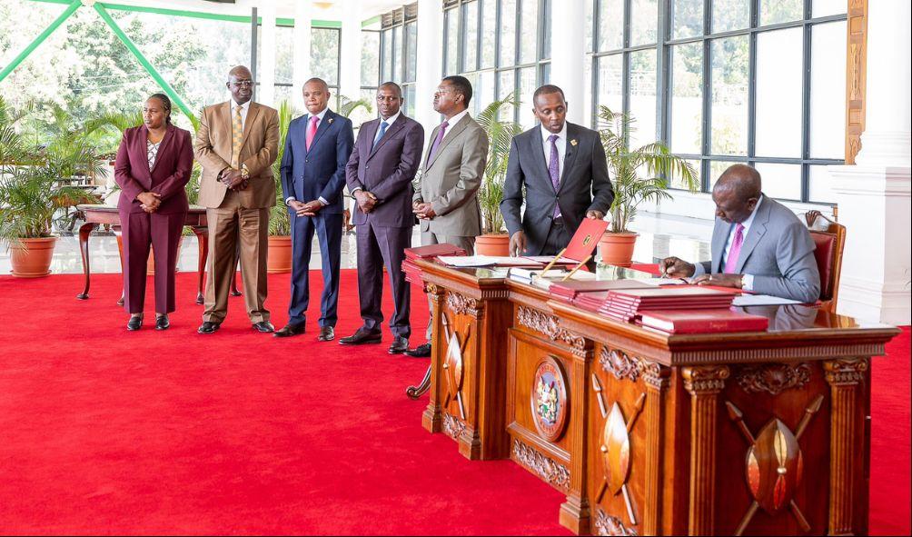 President William Ruto poses for a picture with senior state officers after assenting to Seven Amendment Bills on December 11, 2024