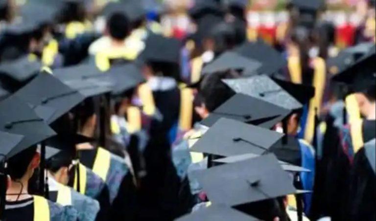 University students standing in line during graduation