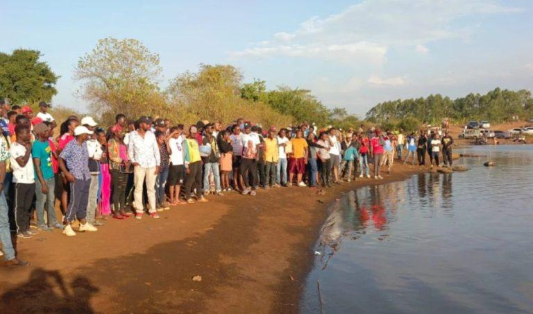 Onlookers at the spot where two university students drowned over the weekend in a fun excursion gone awry.