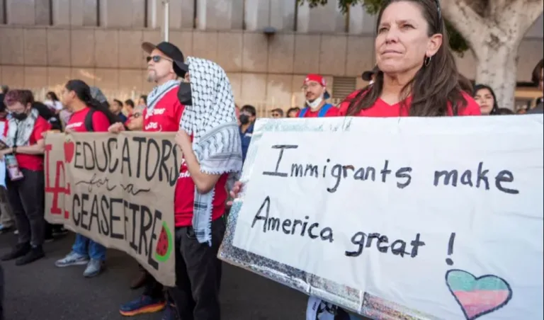 Immigrant rights advocates and migrant workers march on the 'International Day of Action and Solidarity with Migrants' on December 18, 2024, in Los Angeles, California [Damian Dovarganes/AP Photo]
